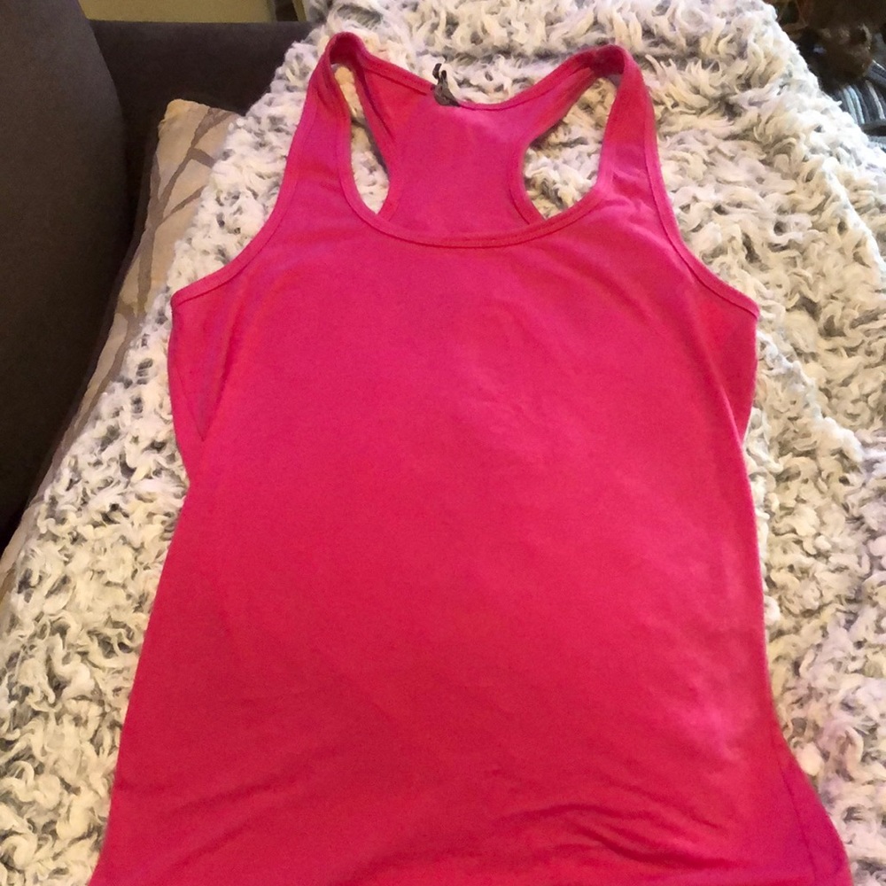 Pink workout tank size Lg, great condition. Logo design is on back of shirt.